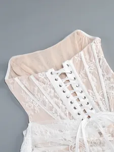 Detailed close-up view of elegant white lace corset dress with functional lace-up back