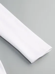 Close-up of the elegant white long sleeve cuff and smooth fabric texture