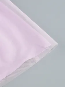 Macro view of purple mesh fabric detail showing translucent layered tulle texture.