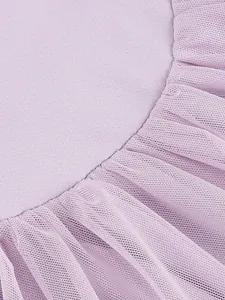Close-up of lavender mesh tulle and smooth fabric detailing on a purple banquet dress.