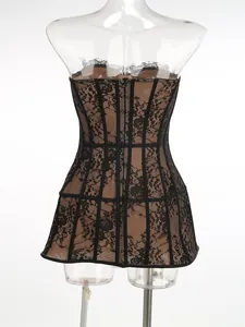 Back view of a black lace corset dress with mesh detailing on a clear mannequin
