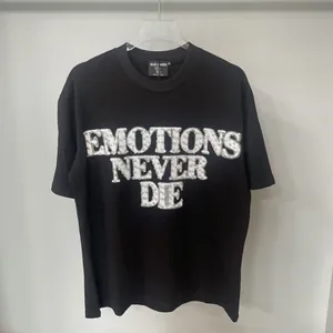 Black American high street loose cotton T-shirt featuring rhinestone Emotions Never Die text