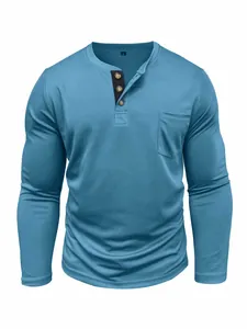 Detailed view of men's long sleeve blue Henley t-shirt with front pocket and button placket