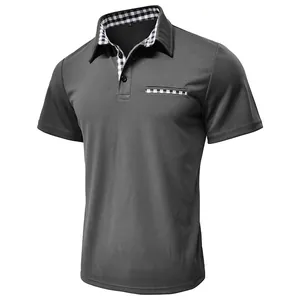 Detail view of dark grey men's polo shirt featuring checkered collar and pocket accents.