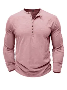 Detail of a pink long-sleeved slub cotton Henley shirt with a multi-button placket
