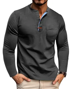 Macro detail of men's long sleeve grey Henley shirt with contrast blue neck and pocket