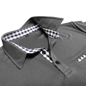 Detailed view of grey men's short sleeve polo shirt with plaid patterned inner collar design