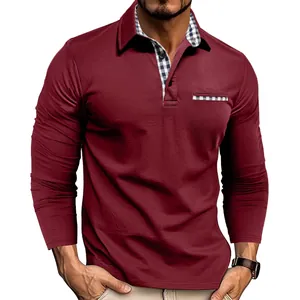 Detail of a men's burgundy long sleeve polo shirt with plaid collar and pocket accents.