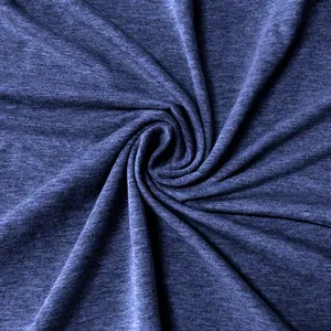 Detailed macro view of soft navy blue heathered fabric texture featuring a spiral fold pattern