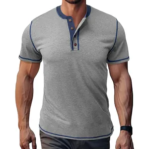 Close-up of grey short-sleeve Henley shirt with navy contrast stitching and button detail