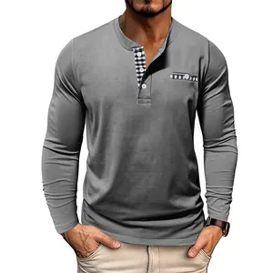 Close-up detail of men's grey long-sleeve Henley shirt featuring a contrast plaid placket