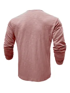 Back view of a men's long-sleeve slub cotton T-shirt in a dusty rose faded color