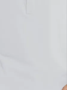 Detail showing the white cotton long sleeve Henry shirt neckline and button placket