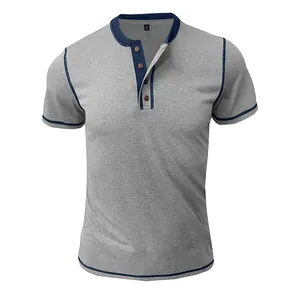 Detail of grey short-sleeved Henley shirt with navy contrast stitching and buttons