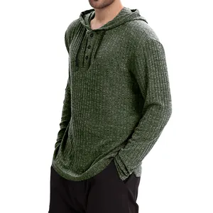 Close-up detail of men's ribbed long-sleeved hooded shirt with henley button neckline