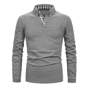 Detail view of men's grey long-sleeve polo shirt with plaid collar and pocket trim