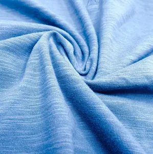 Macro shot of breathable light blue slub cotton fabric texture for men's t-shirts