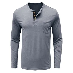 Detail of men's slim fit cotton Henley shirt featuring a front pocket and button neckline.