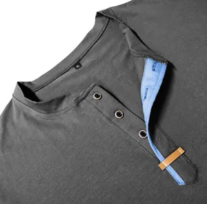 Close-up detail of a men's grey Henley shirt with blue contrast placket and buttons