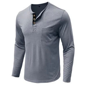 Detailed view of grey-blue long-sleeve Henley shirt with buttoned neck and chest pocket