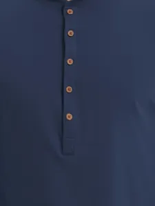 Close-up detail of a navy blue Henley shirt featuring five brown buttons on the placket.