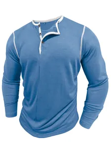 Close-up of blue men's Henley shirt featuring contrast white trim and button placket