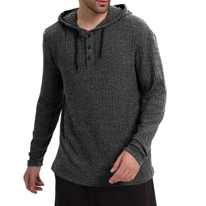 Detailed macro view of dark grey ribbed long sleeve hooded henley shirt for men