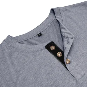 Detailed close-up showing the grey cotton fabric and buttoned neckline of a men's Henley shirt.