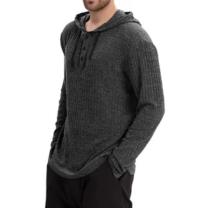 Close-up of men's dark grey hooded shirt with buttoned placket and ribbed texture
