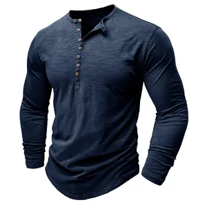 Detail of navy blue long sleeve Henley shirt featuring slub cotton texture and wood buttons