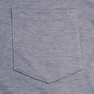 Close-up detail showing the stitching of a breast pocket on a gray cotton men's T-shirt