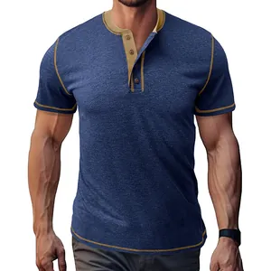 Close-up of a men's blue short sleeve Henley shirt with contrast khaki stitching detail