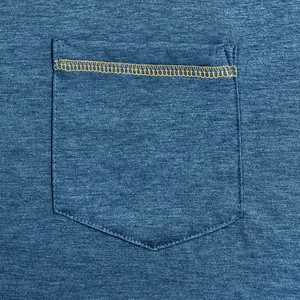 Close-up of blue quick-dry T-shirt pocket with yellow contrast stitching detail