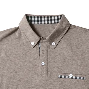 Detailed close-up of men's polo shirt with button-down collar and checkered pocket detail