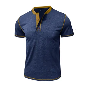 Detail view of a navy blue short sleeve Henley shirt with yellow contrast stitching