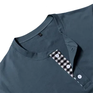 Close-up view of a blue men's Henley shirt collar with checkered button placket details