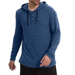 High-quality close-up detail of blue ribbed knit men's long-sleeved hoodie with buttons.