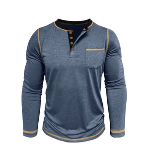 Detailed view of men's blue long sleeve Henley T-shirt with 4-button placket and chest pocket