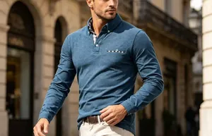 Close-up of a stylish men's blue long-sleeve polo shirt with plaid collar accents.