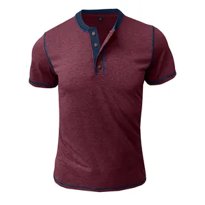 Close-up detail of a burgundy short sleeve Henley t-shirt with navy trim and wood buttons