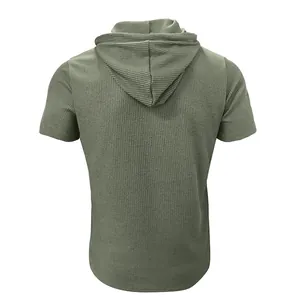 Back view of a green ribbed textured short sleeve hooded t-shirt for men fashion wear