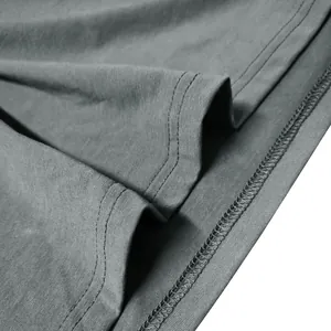 Detailed close-up of grey Henley shirt stitching and cotton fabric texture
