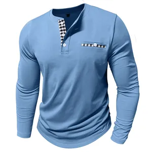 Detail of blue men's long sleeve Henley shirt with plaid trim on collar and pocket