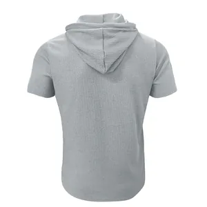 Back view of a grey short-sleeved hooded T-shirt featuring a unique ribbed fabric texture.