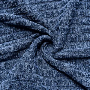 Macro detail shot showing the soft navy blue ribbed knit fabric texture and weave