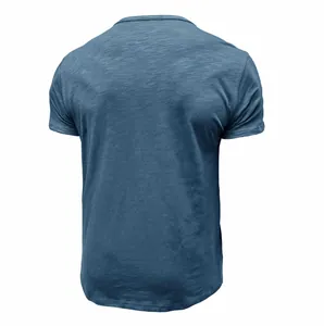 Detailed back view of a classic blue men's t-shirt made of soft slub cotton fabric