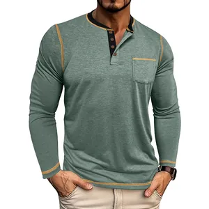 Detail view of a men's sage green long-sleeved Henley shirt with orange contrast stitching