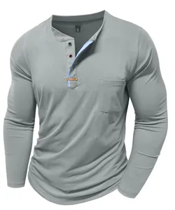 Detail shot of grey men's Henley shirt featuring a contrast blue placket and pocket