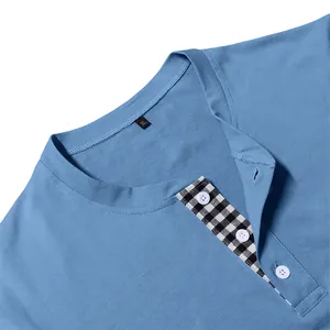 Close-up of men's blue Henley shirt collar with checkered button placket