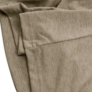 Close-up of double-needle hem stitching on breathable khaki cotton T-shirt